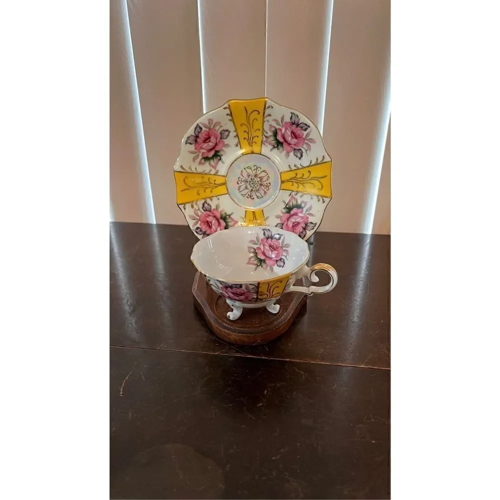 VINTAGE IRIDESCENT YELLOW TEA CUP AND SAUCER WITH ROSES